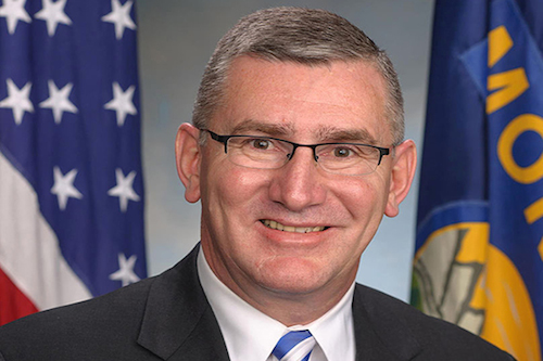 Senator John Walsh (D–MT) wears a facial expression he plagiarized from a box of Lemonheads.