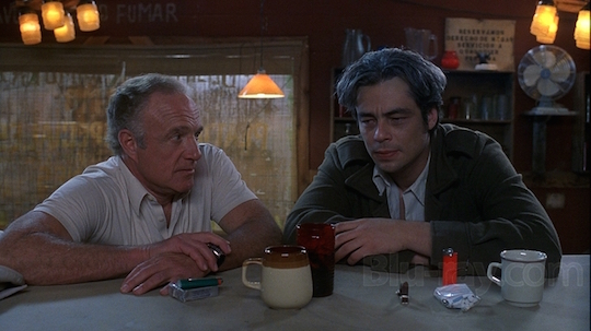 Benicio del Toro enjoys some on-the-nose dialogue with James Caan's bagman in The Way of the Gun